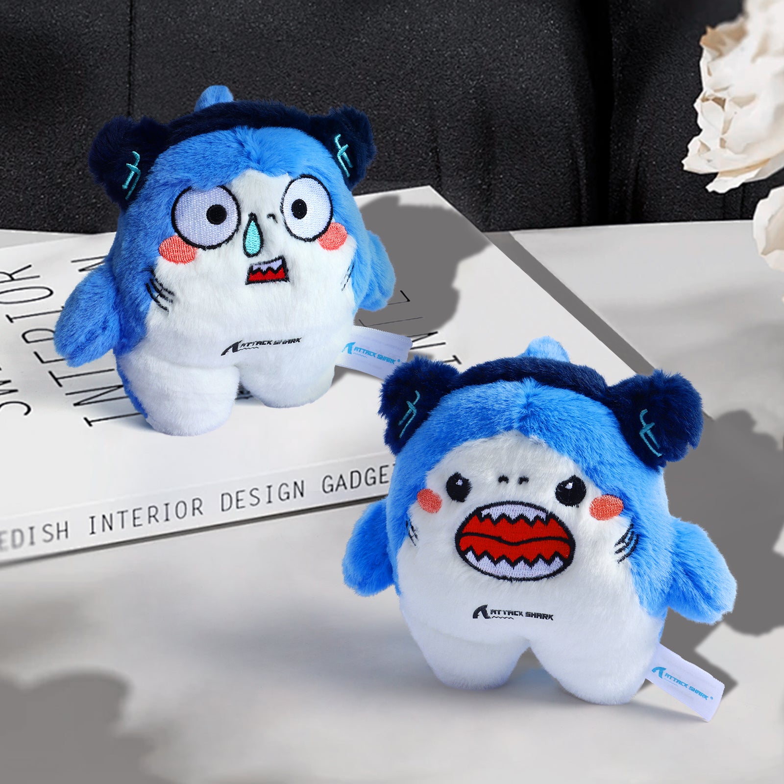 Attack Shark mascot plush toys on display