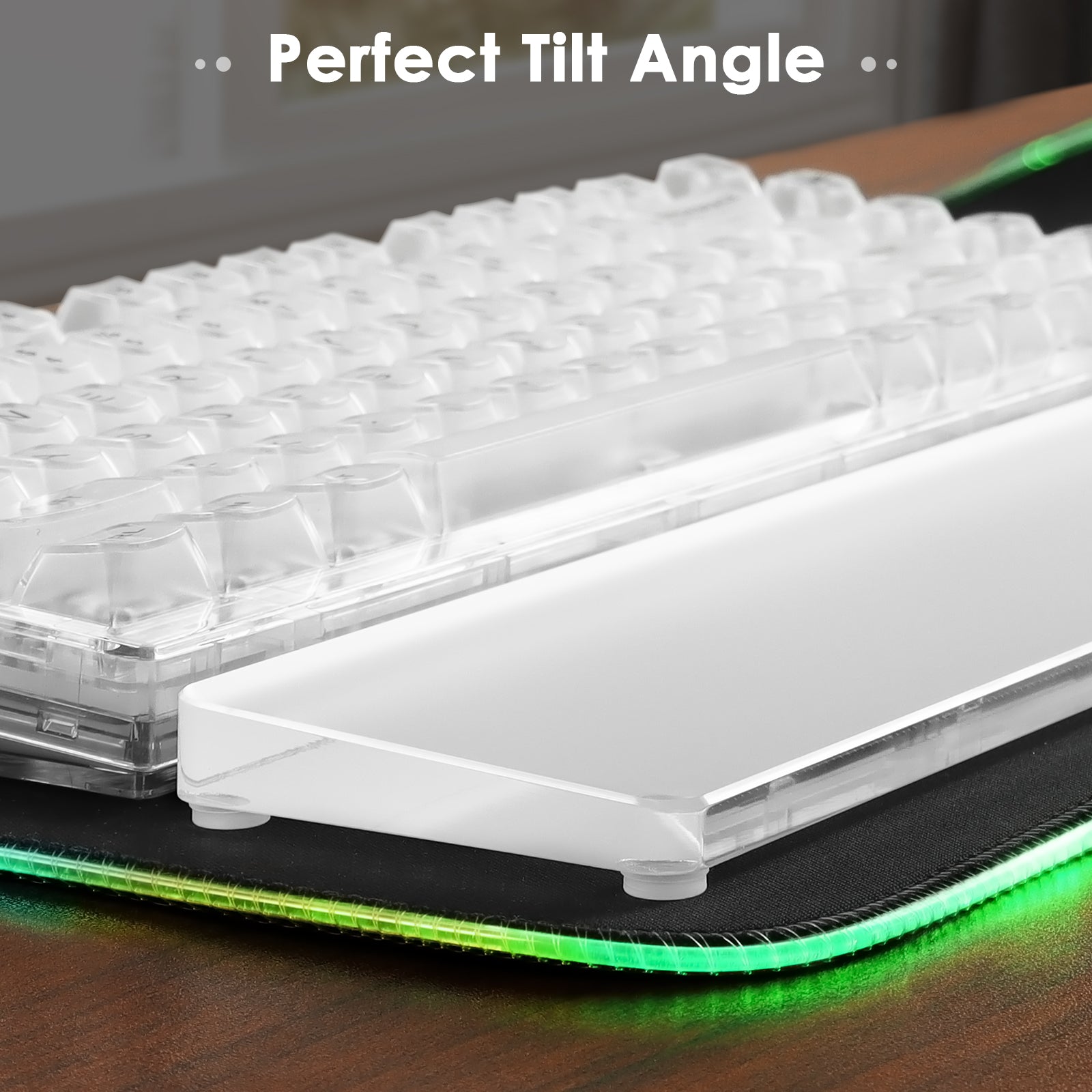 Clear acrylic wrist rest at perfect tilt angle beside a mechanical keyboard.