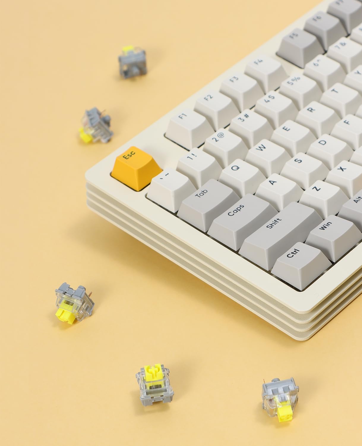 ATTACK SHARK x AJAZZ AS Switches (tactile & linear) with yellow stems, next to a keyboard with yellow Esc key.